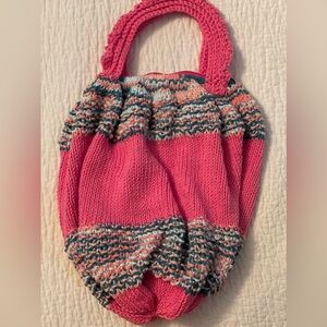 Hand knit market bag with zipper.  Measuring 14” long, 12” wide.